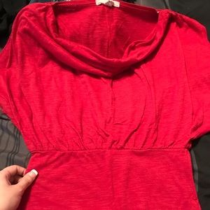 Beautiful red form fitting shirt with flows neck